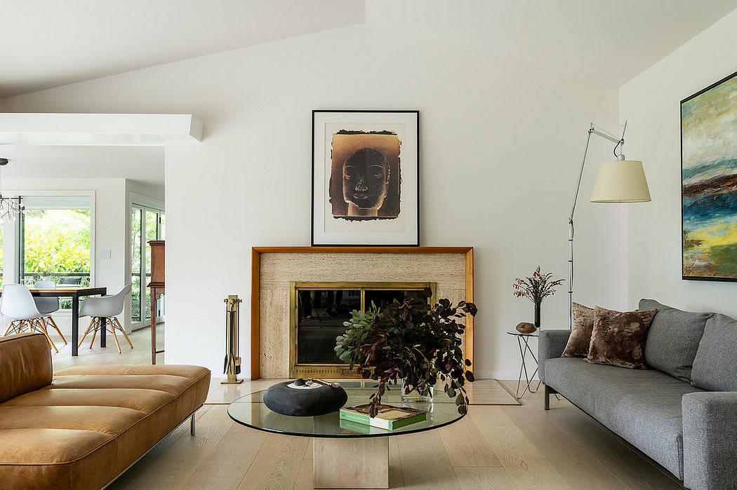 Warm, modern living room with wood fireplace, art, and natural plants.