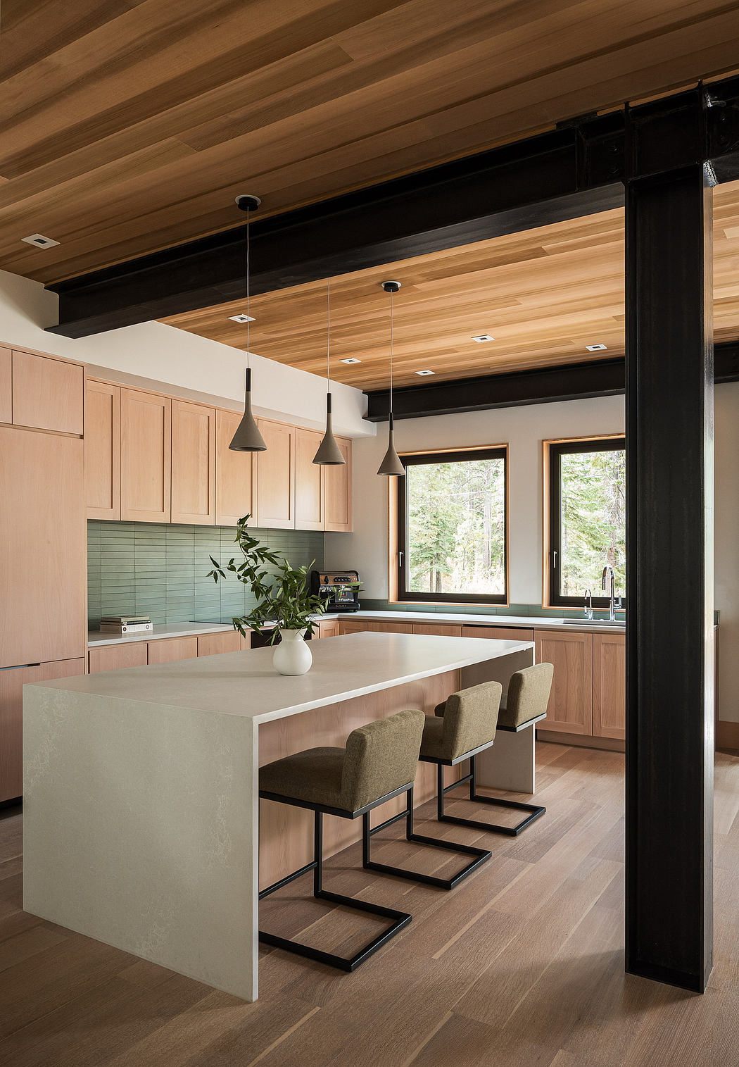 Contemporary kitchen with wooden ceiling, pastel cabinetry, and white island.
