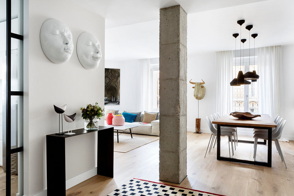 Chic urban apartment with minimalist decor and artistic accents.
