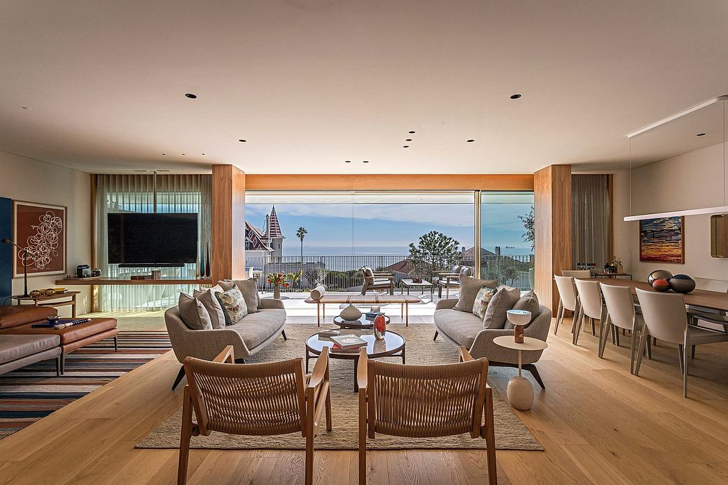 Contemporary living room with ocean view and sleek furnishings.