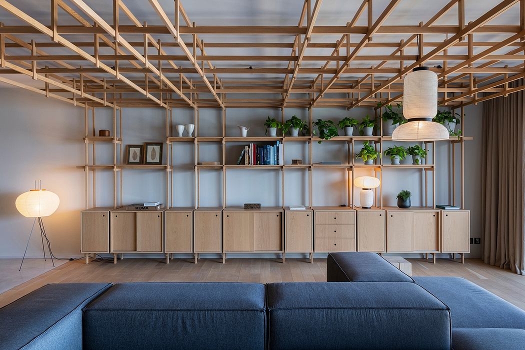 Expansive wooden shelving system with integrated storage, lighting, and plants.