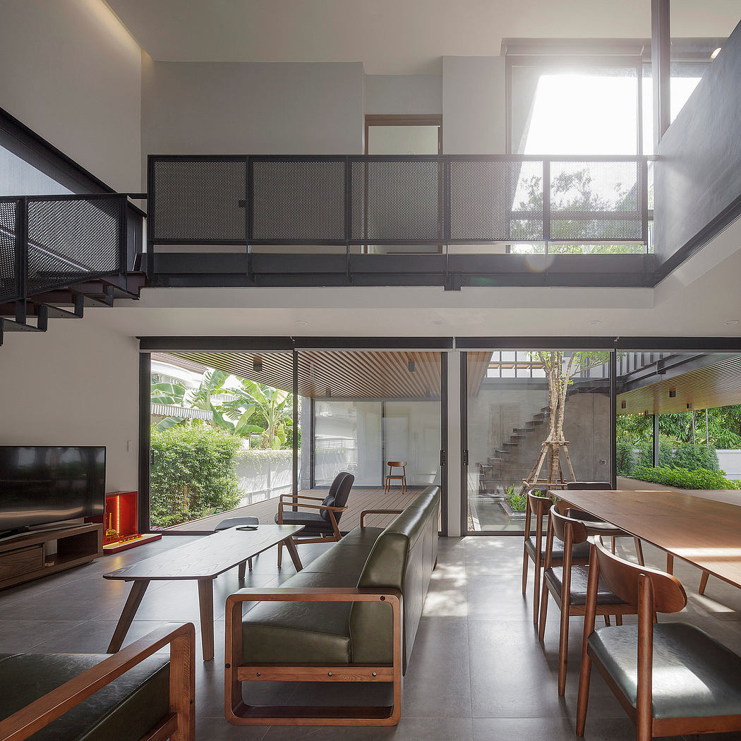 Minimalist modern home interior with open layout, wood paneled ceiling, and lush greenery.