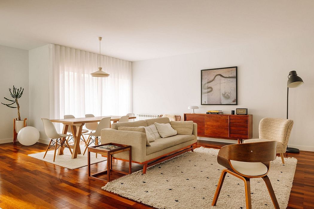 Spacious living room with wooden furniture, neutral tones, and midcentury modern decor.