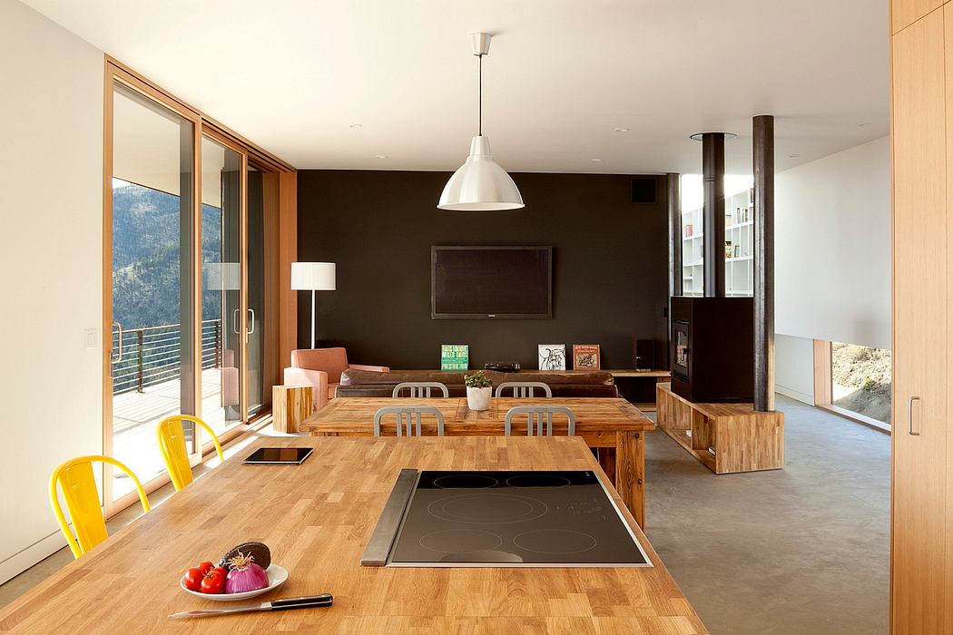 Modern kitchen with wooden dining area and minimalist decor.