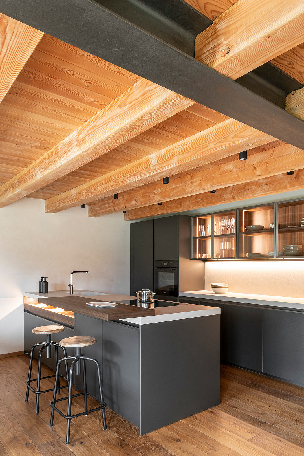 Rustic wooden beams create a cozy atmosphere in this modern kitchen design.