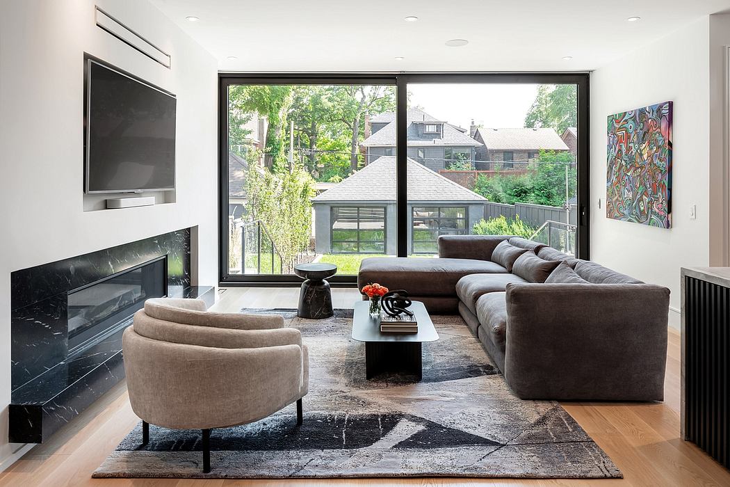 Elegant living room with sleek fireplace and large window.