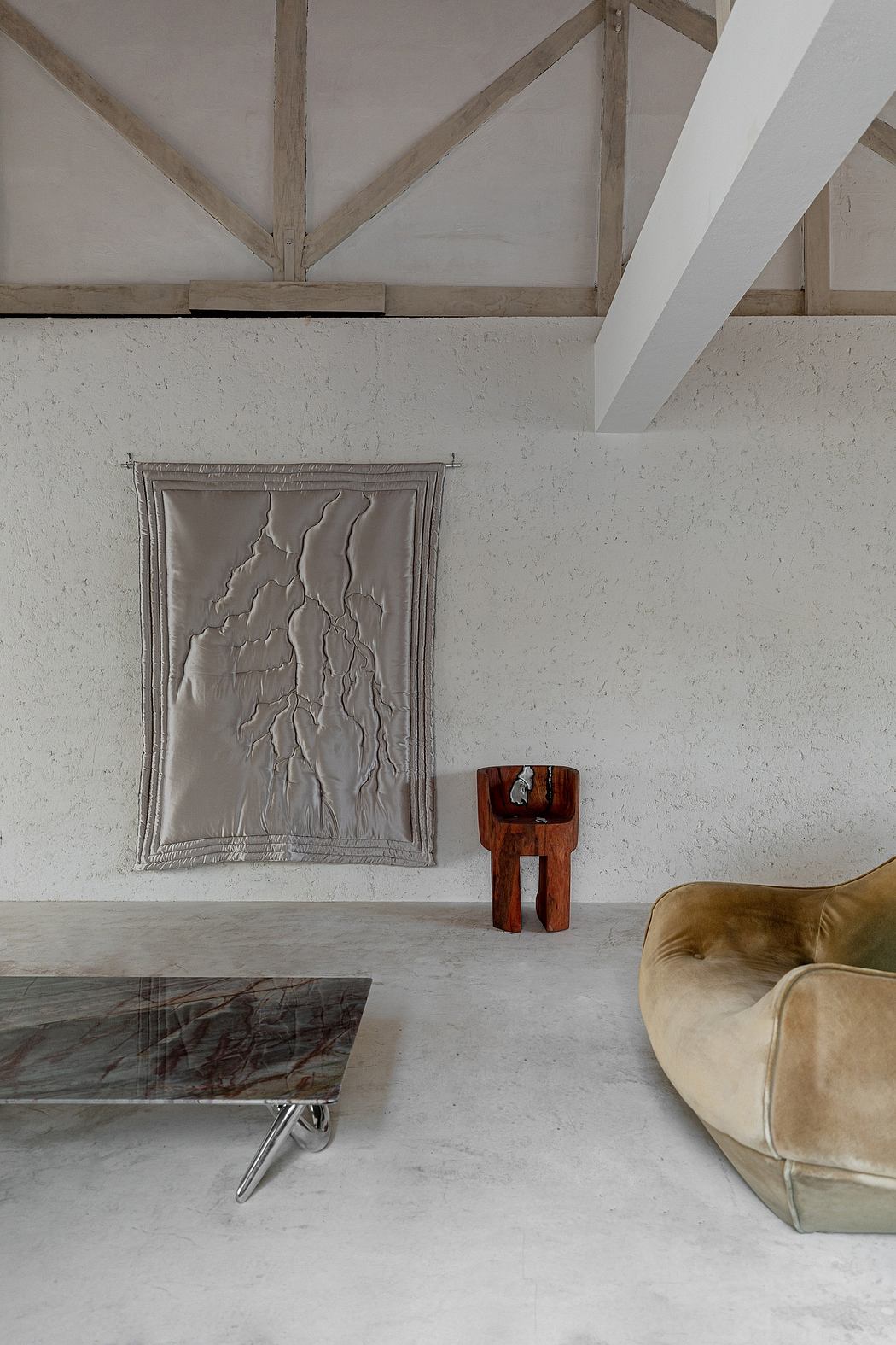 Minimalist room with abstract wall art, wooden beams, and modern furniture.