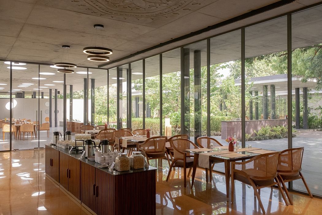 Sleek, modern design with floor-to-ceiling windows, recessed lighting, and natural wood furnishings.