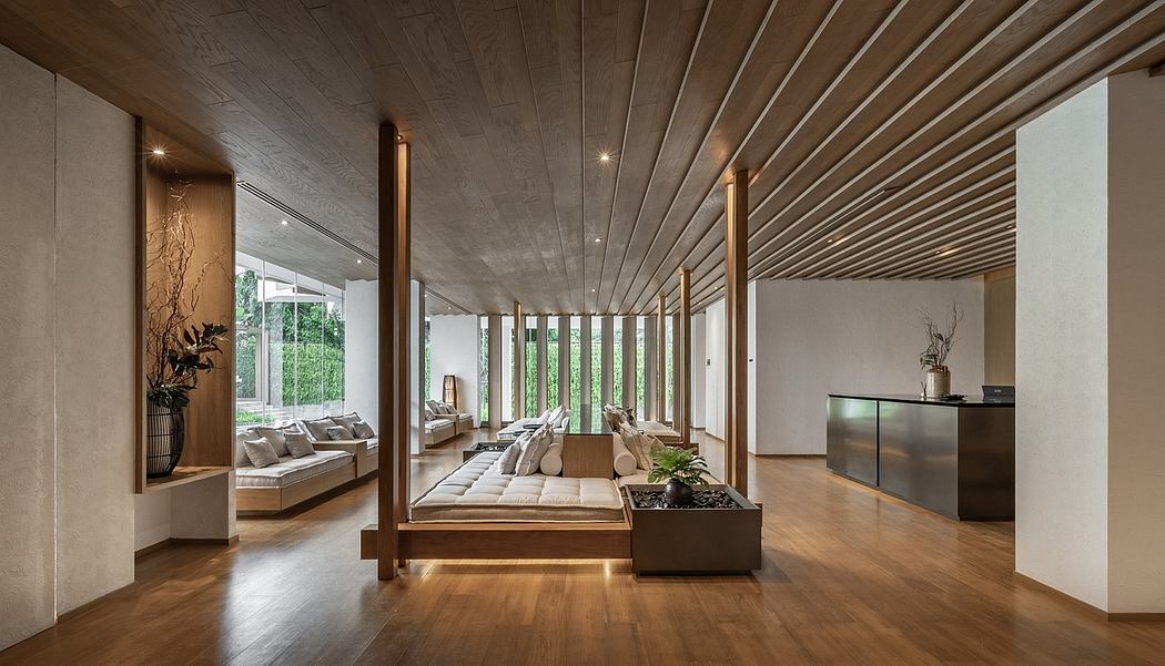 Elegant interior with slatted wooden ceiling and floor-to-ceiling windows.