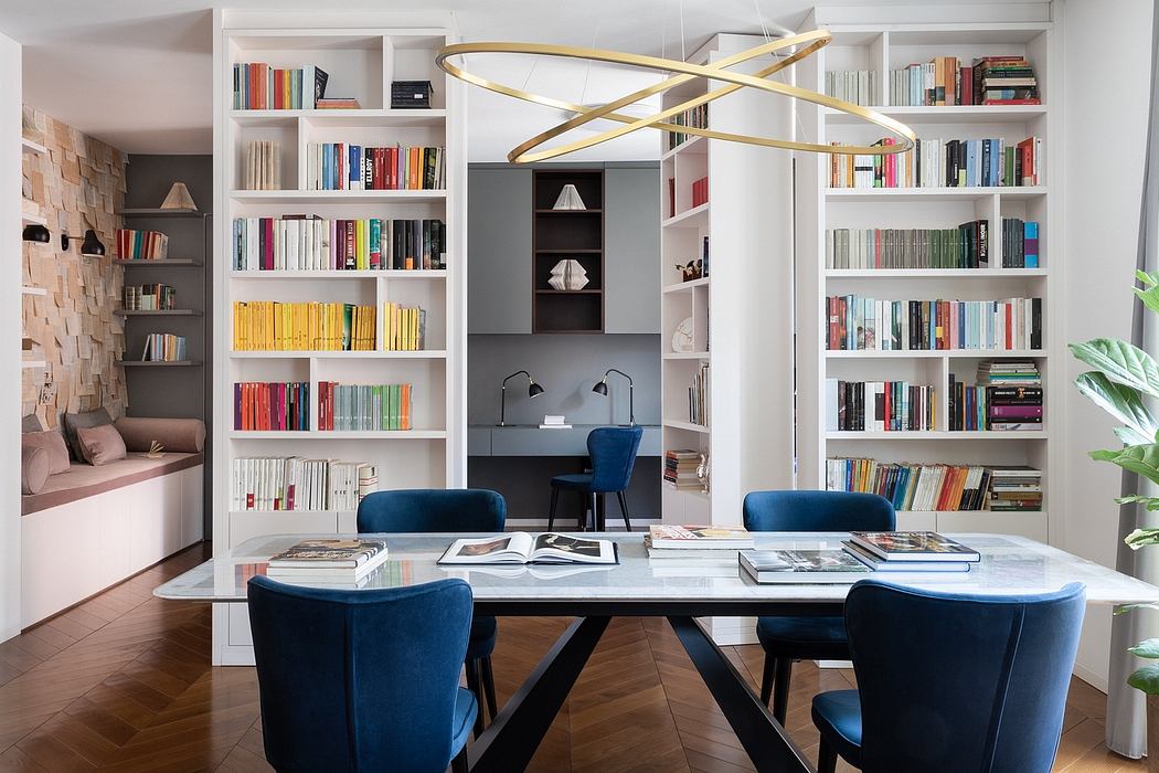 Modern study room with bookshelves, a desk, chairs, and an oval