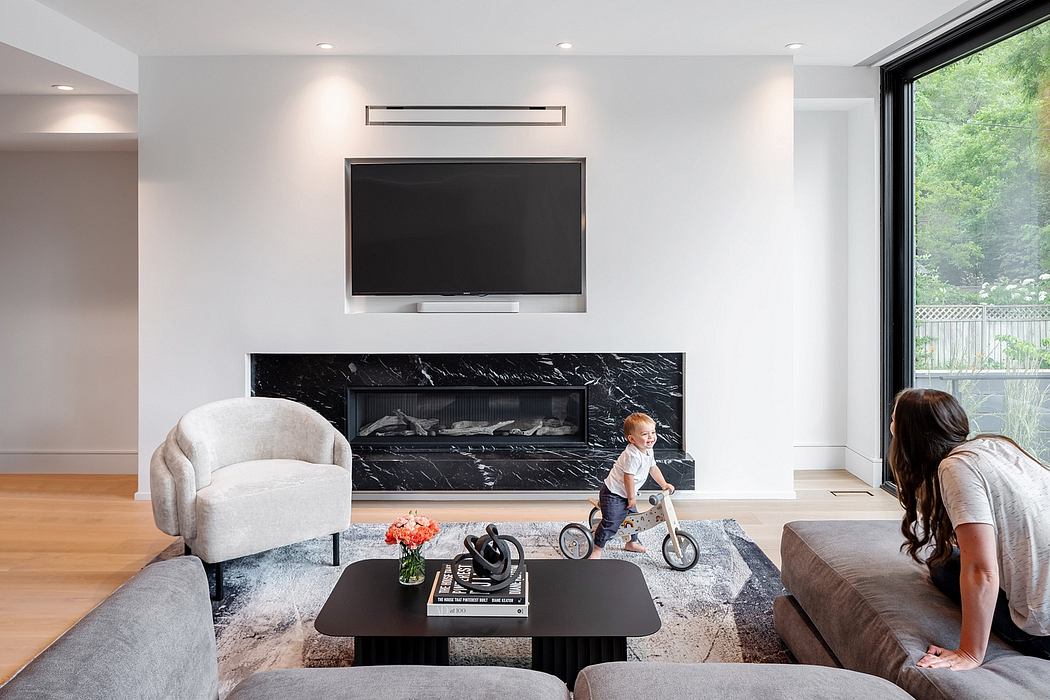 Sleek living room with marble fireplace and minimalist decor.