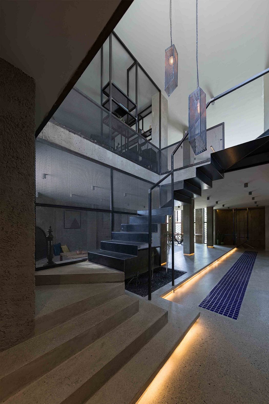 Modern interior with floating staircase and glass enclosure.