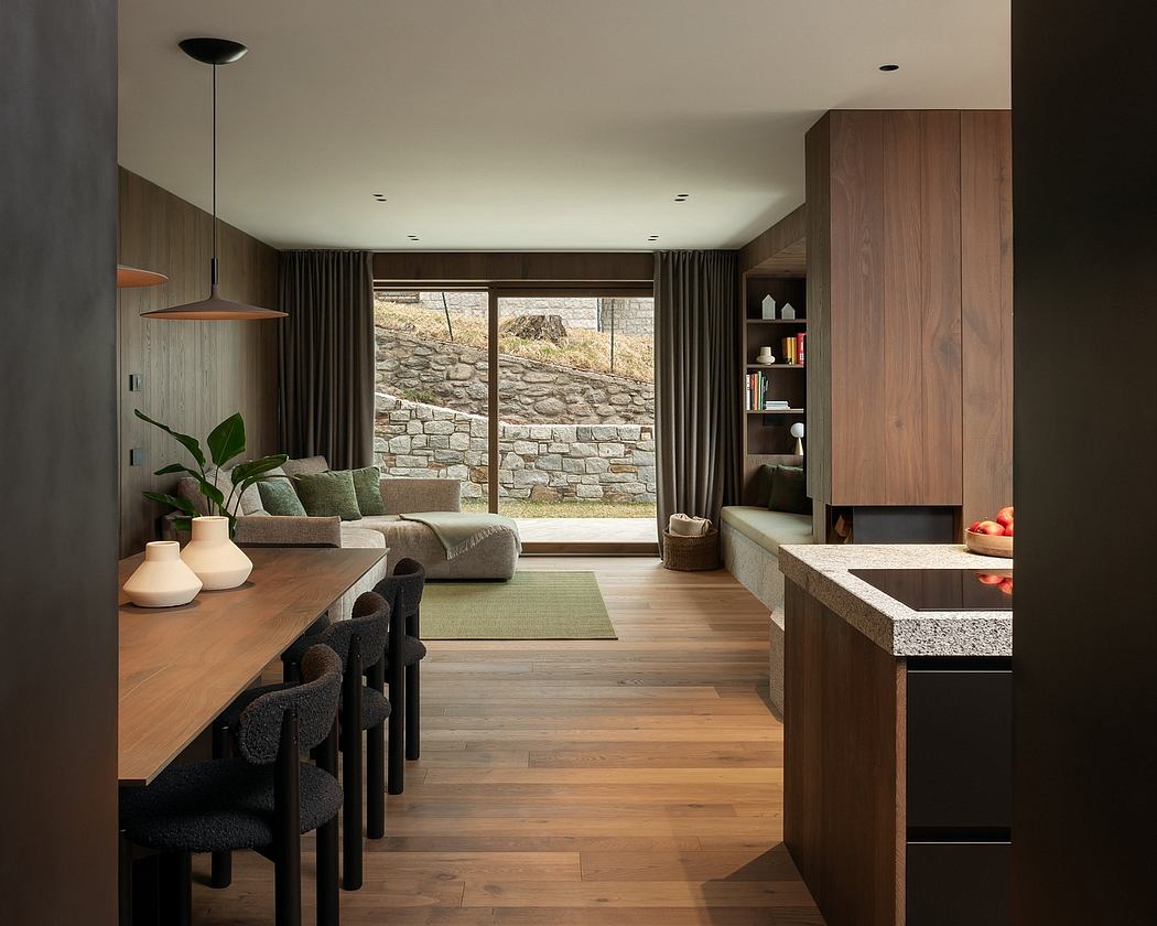 Modern kitchen and dining area with wooden elements and neutral tones.
