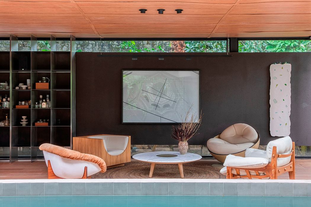 Modern living space with stylish furniture by a poolside.