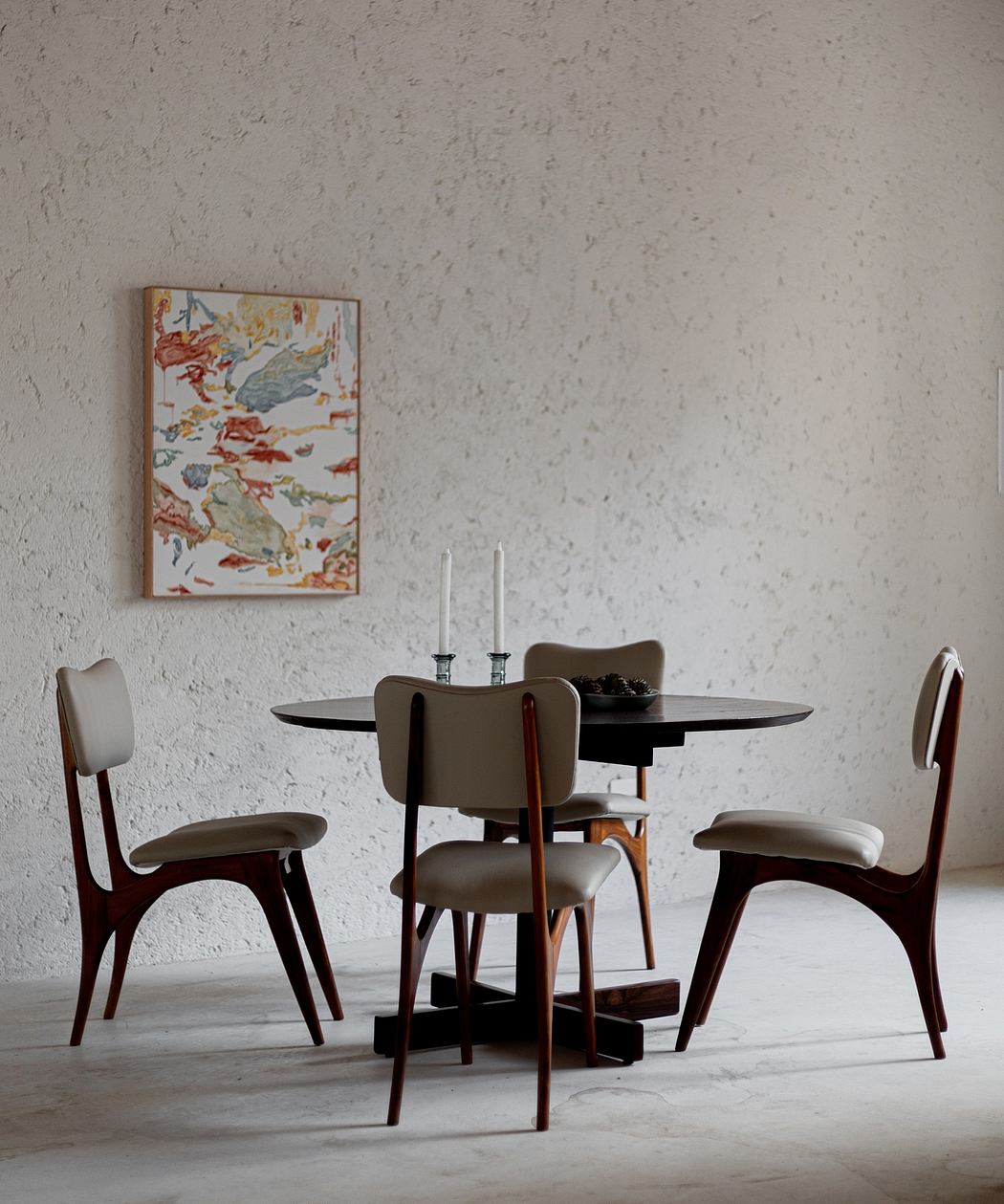 Modern dining room with round table, four chairs, candles, and artwork on wall
