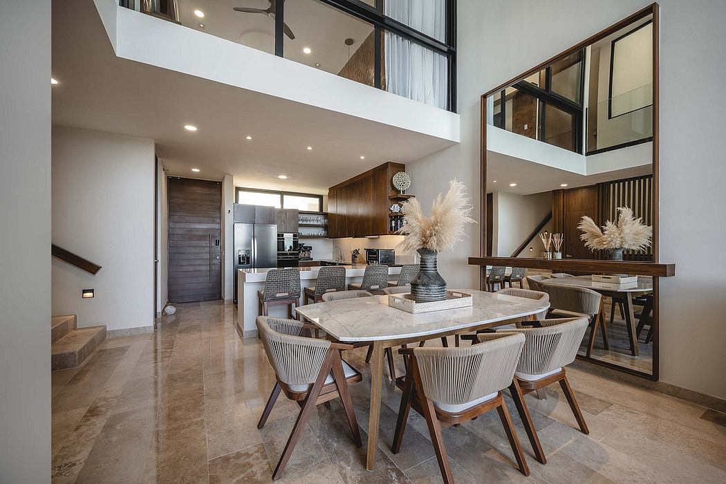 Modern open-concept home interior with high ceiling and mezzanine.