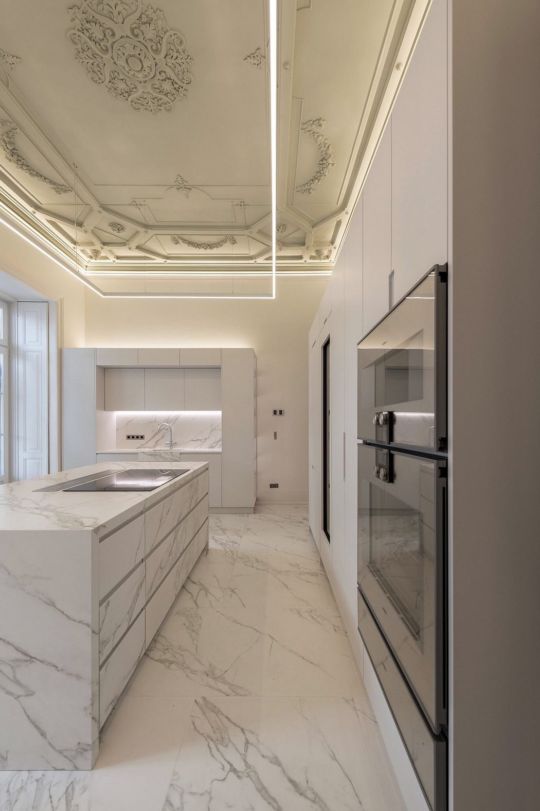 Elegant kitchen with ornate ceiling and marble floors