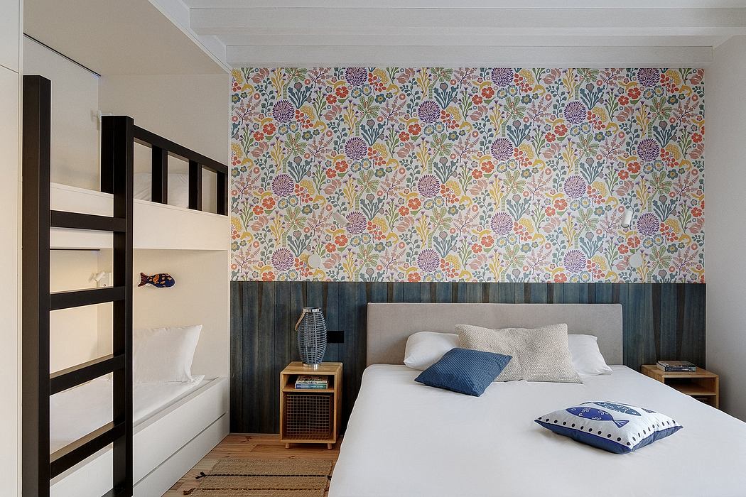 Contemporary bedroom with floral wallpaper and bunk beds.