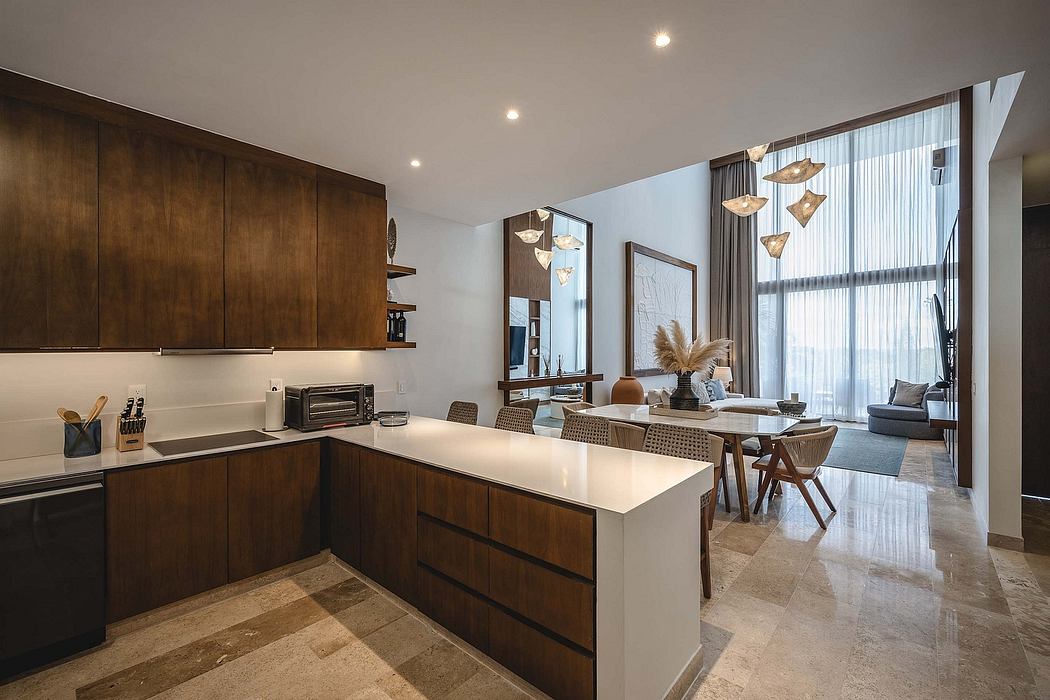 Contemporary kitchen with sleek wooden cabinets and stylish pendant lights.