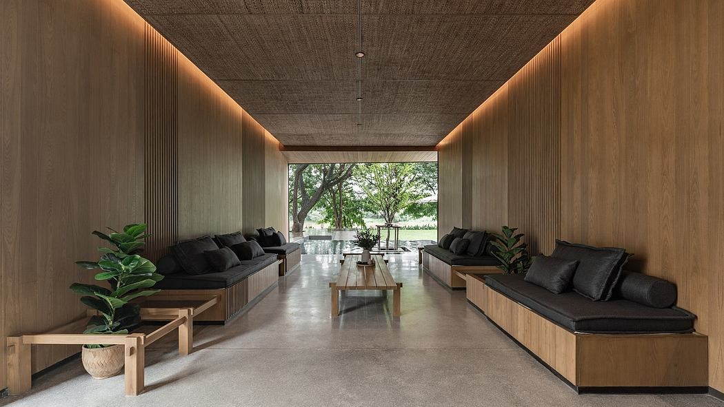 Contemporary lounge with wooden walls, sleek benches, and a large window view of