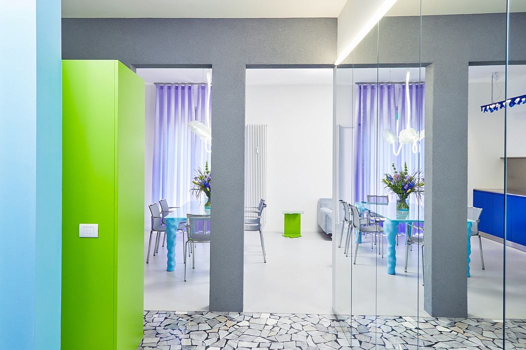 Colorful modern interior with minimalist furniture, subtle lighting, and textured floors.