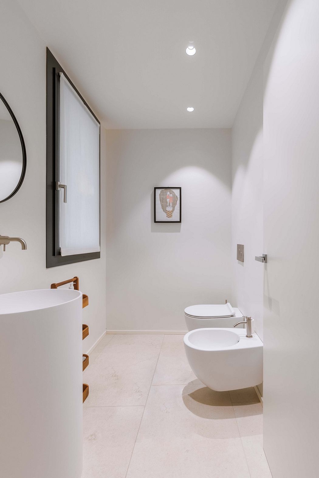 Minimalist bathroom with floating fixtures and neutral tones.