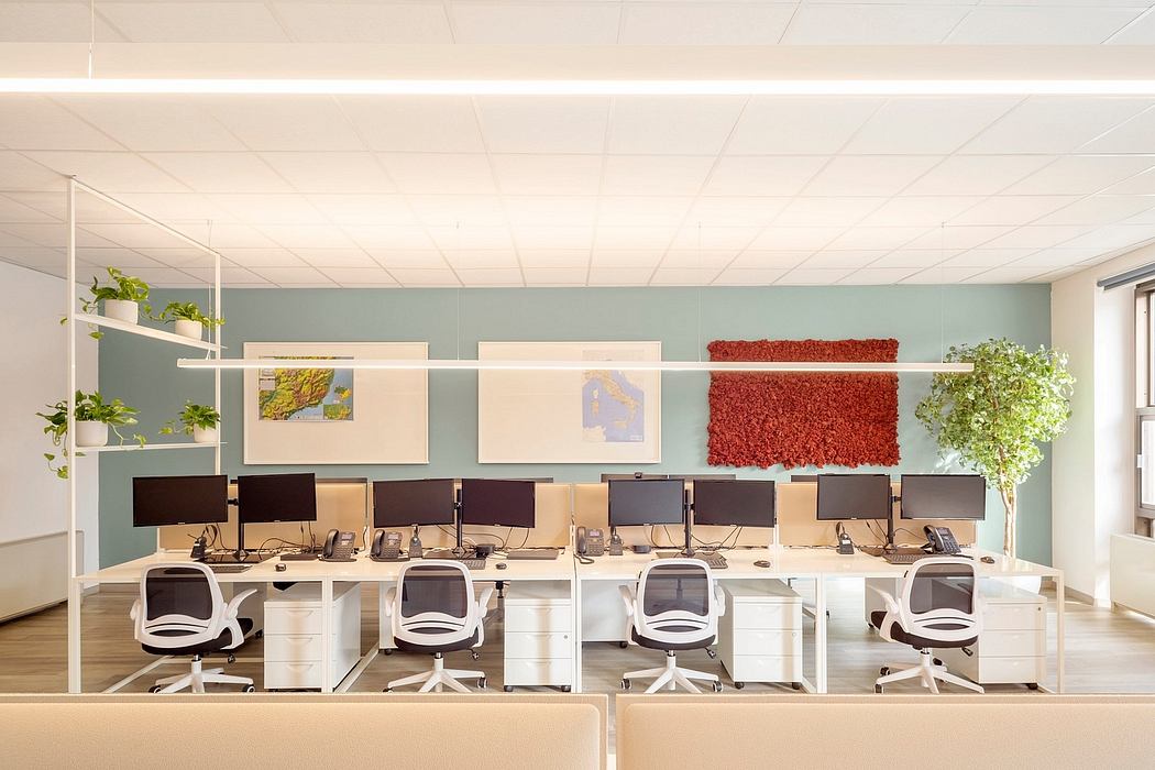 Contemporary open workspace with minimalist furniture, strategic lighting, and vibrant accents.