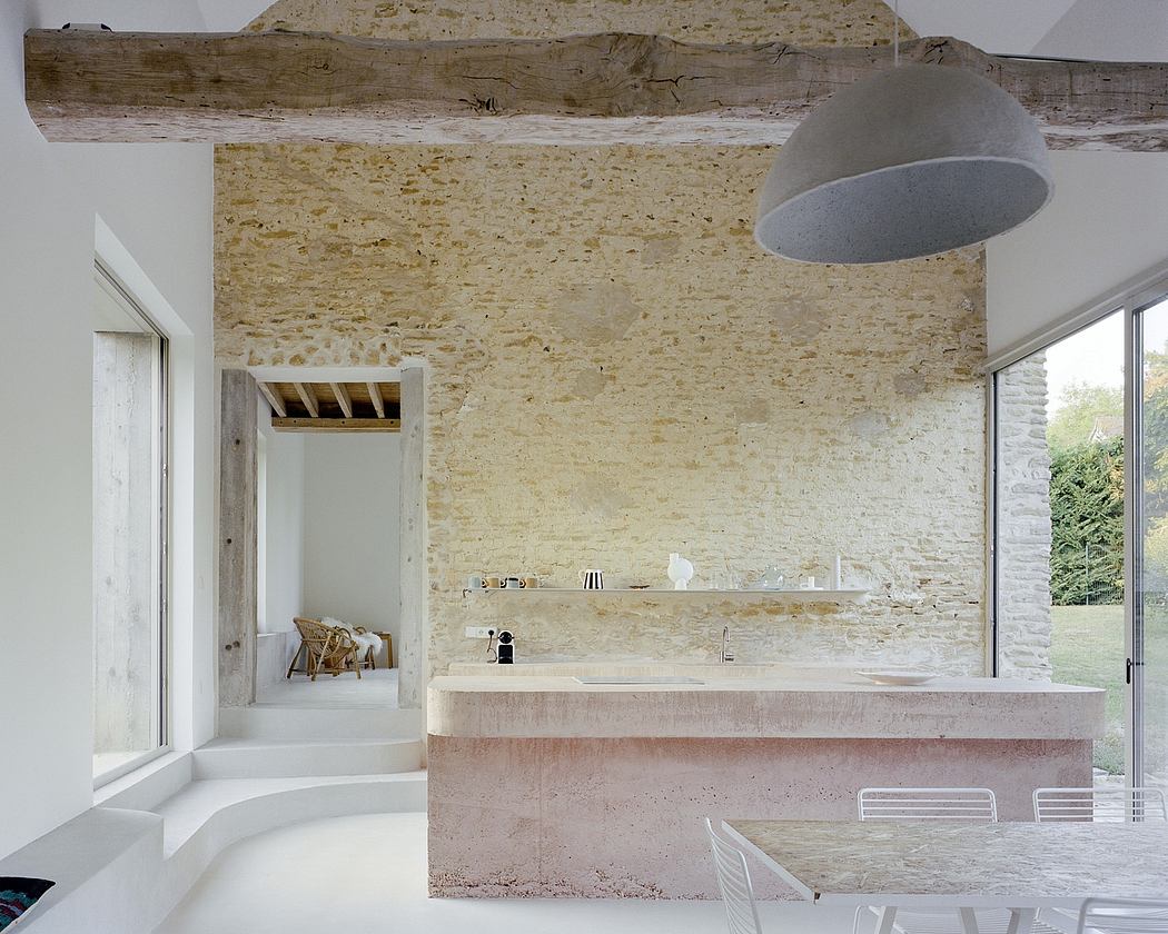 Contemporary kitchen with exposed stone walls and minimalist design.