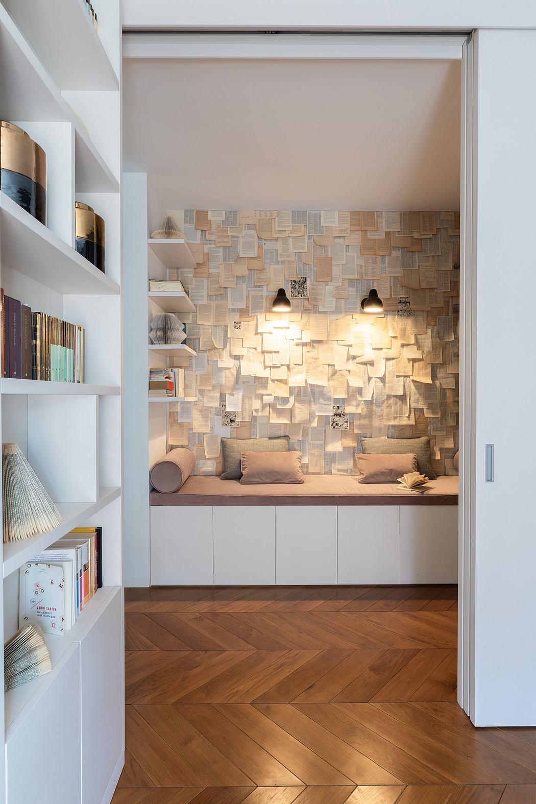 Cozy reading nook with herringbone floor and 3D wall tiles