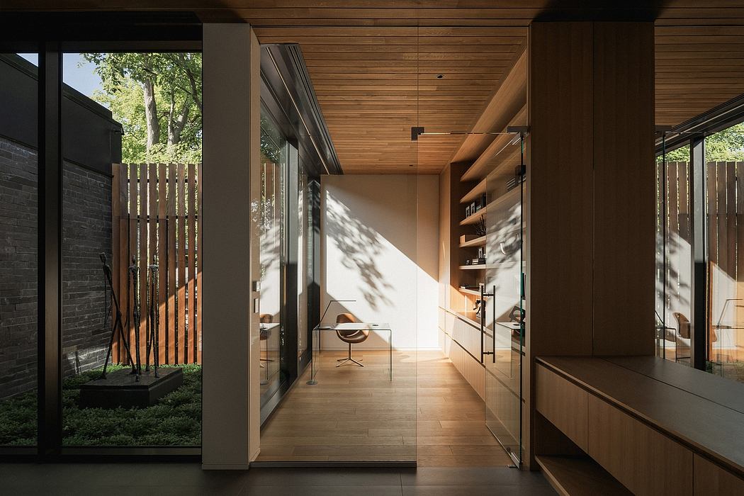 A modern, minimalist interior with wood paneling, floor-to-ceiling windows, and built-in shelving.