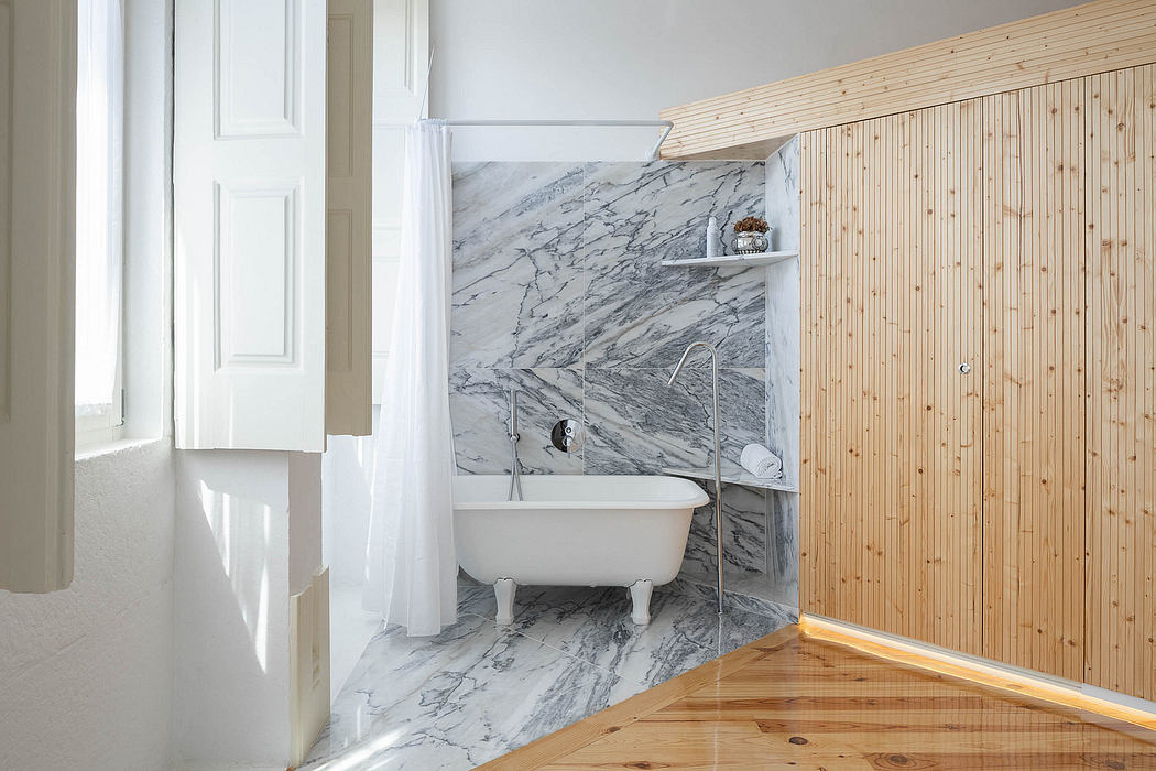 Contemporary bathroom with marble walls and a wooden sauna.