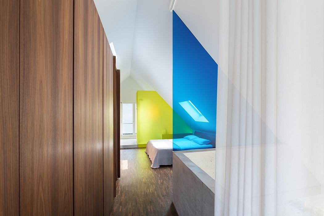 Vibrant colors, geometric shapes, and natural light create an inviting, modern bedroom.
