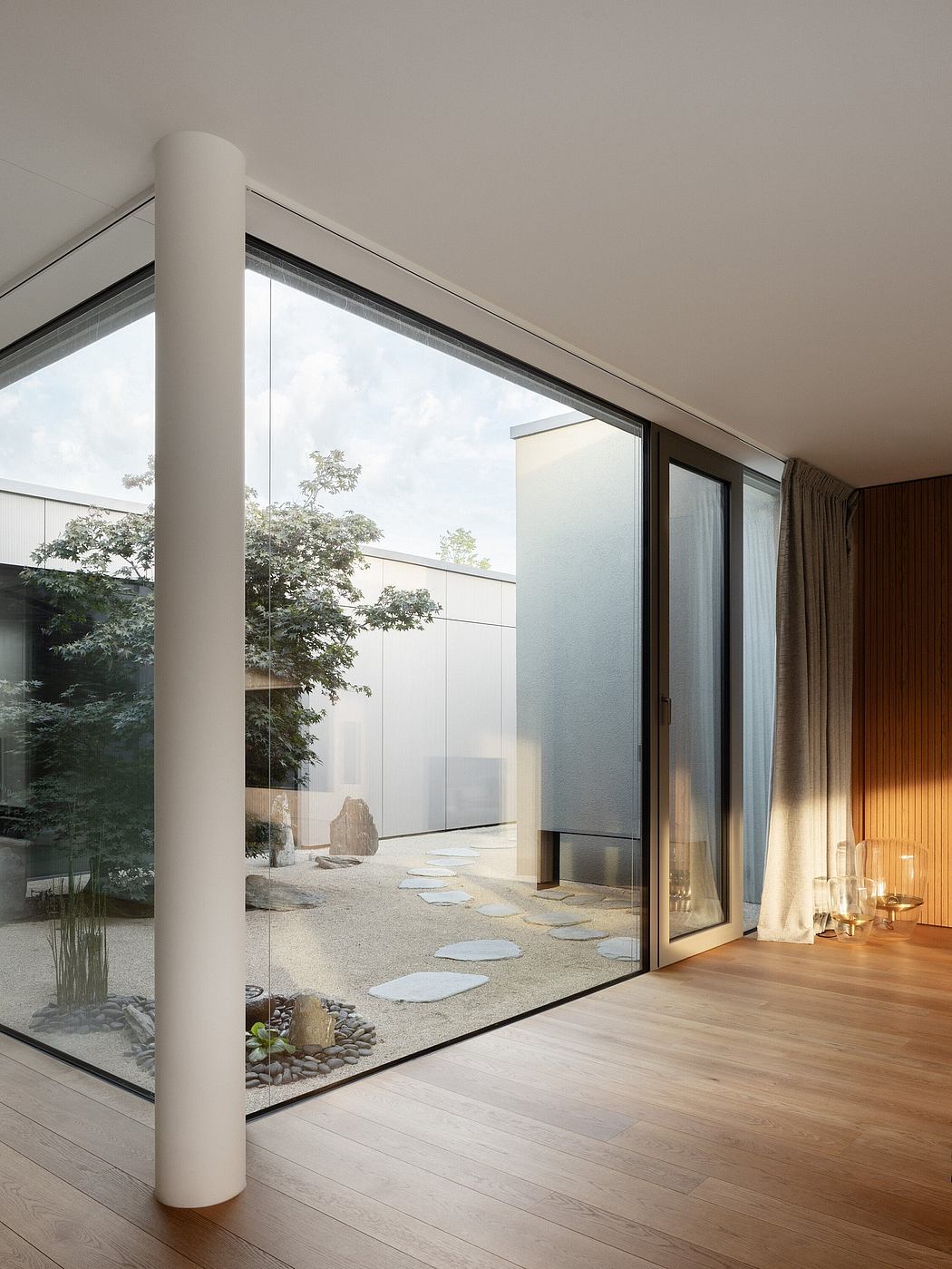 Contemporary room with floor-to-ceiling windows and a small indoor courtyard.