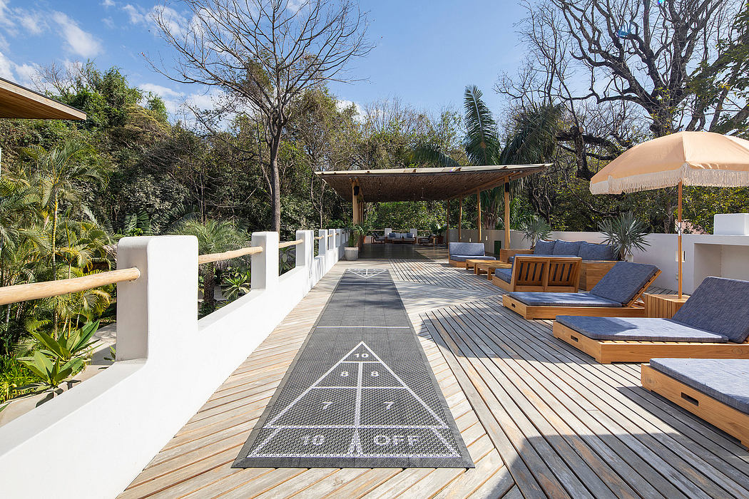Contemporary outdoor deck with loungers and pergola.