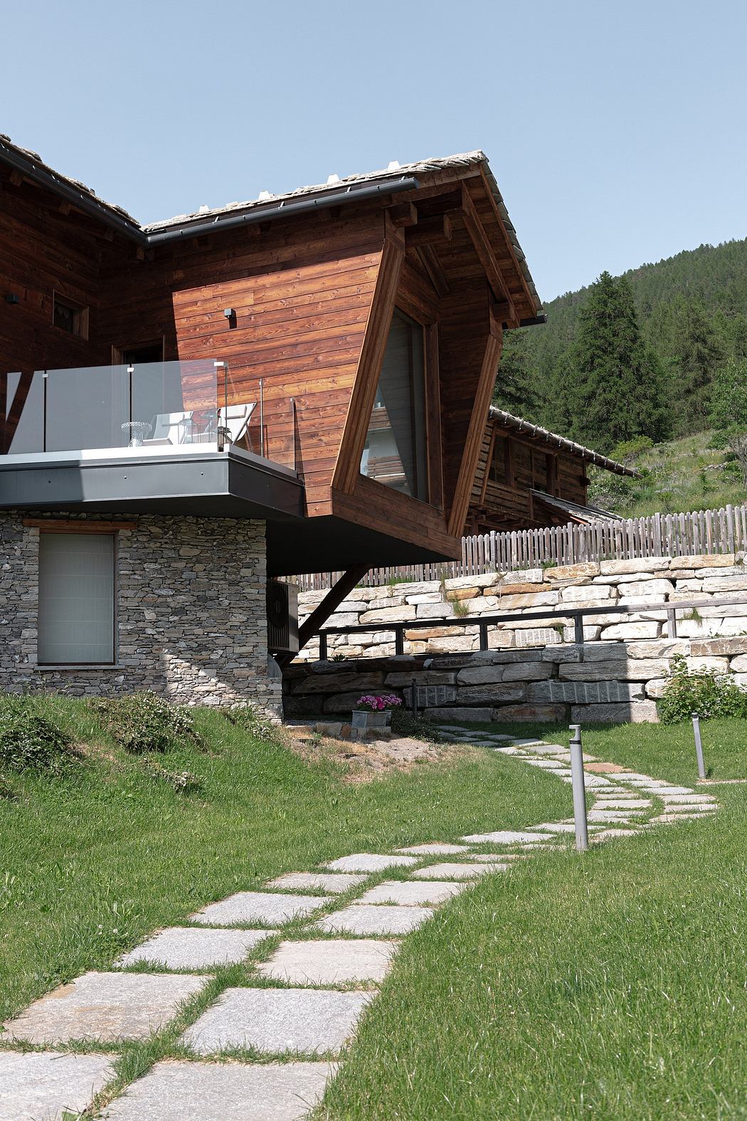 Contemporary wooden house with cantilevered design.