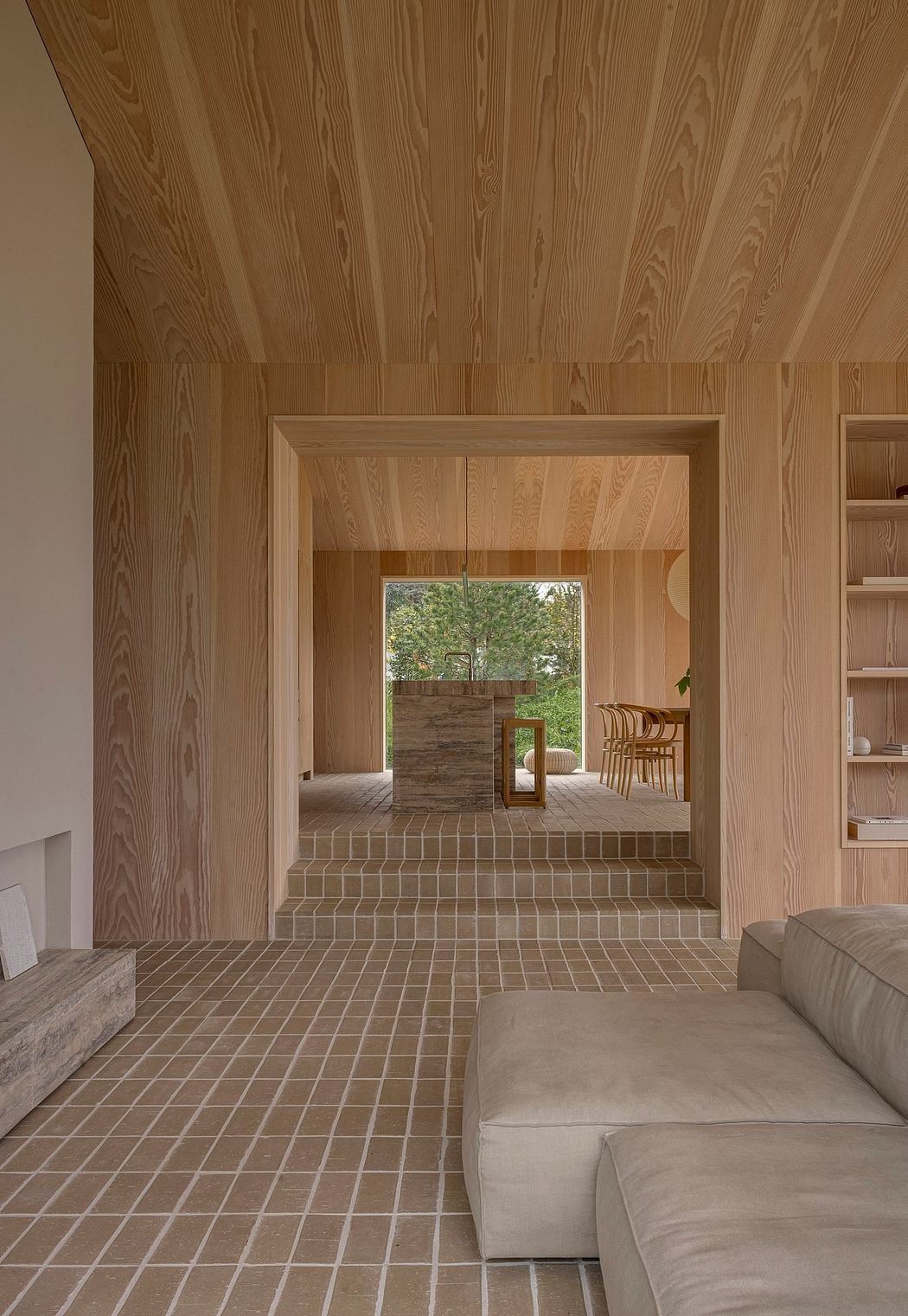 Wood-paneled interior with patterned tile floors and seamless transitions between rooms.