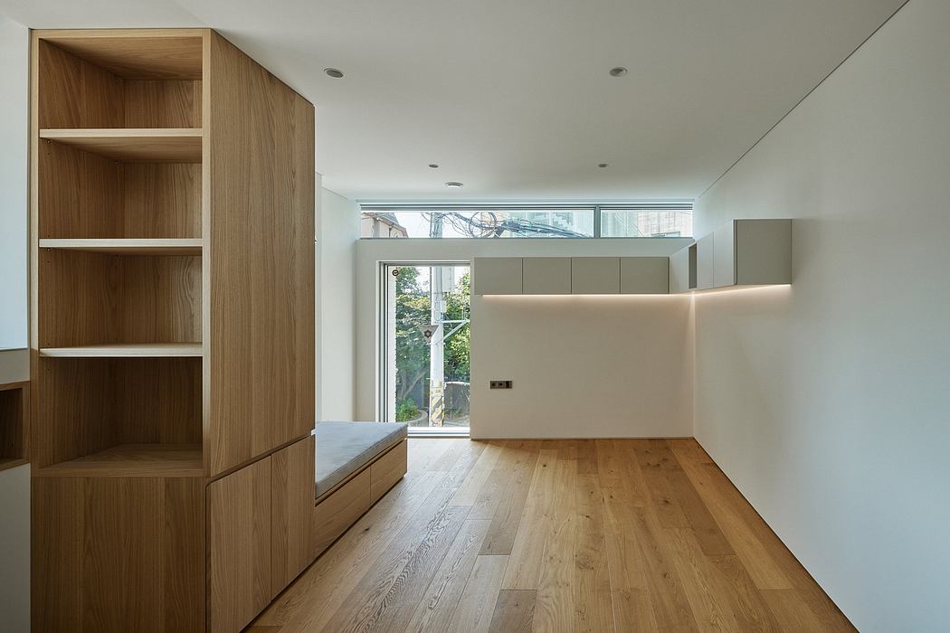Contemporary interior with wooden floors and minimalist shelving.
