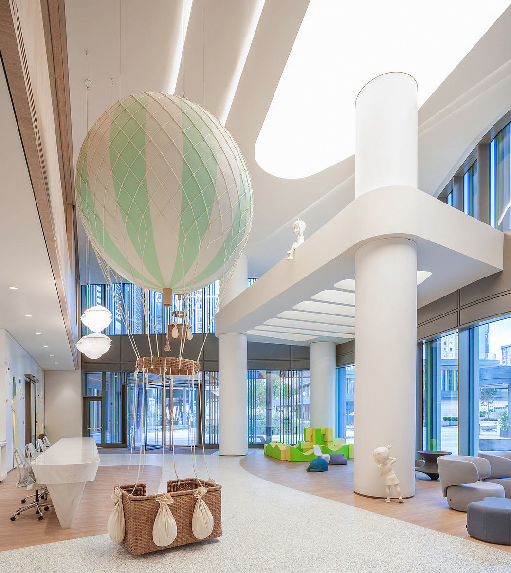 Contemporary lobby with balloon sculpture and colorful furniture.