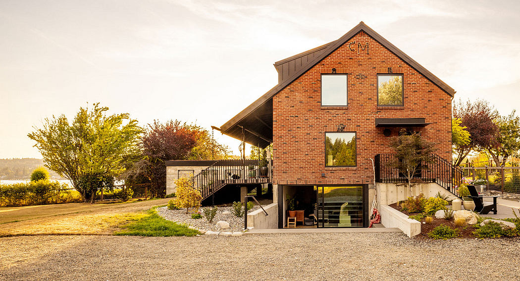 Contemporary two-story brick house with a waterfront view.