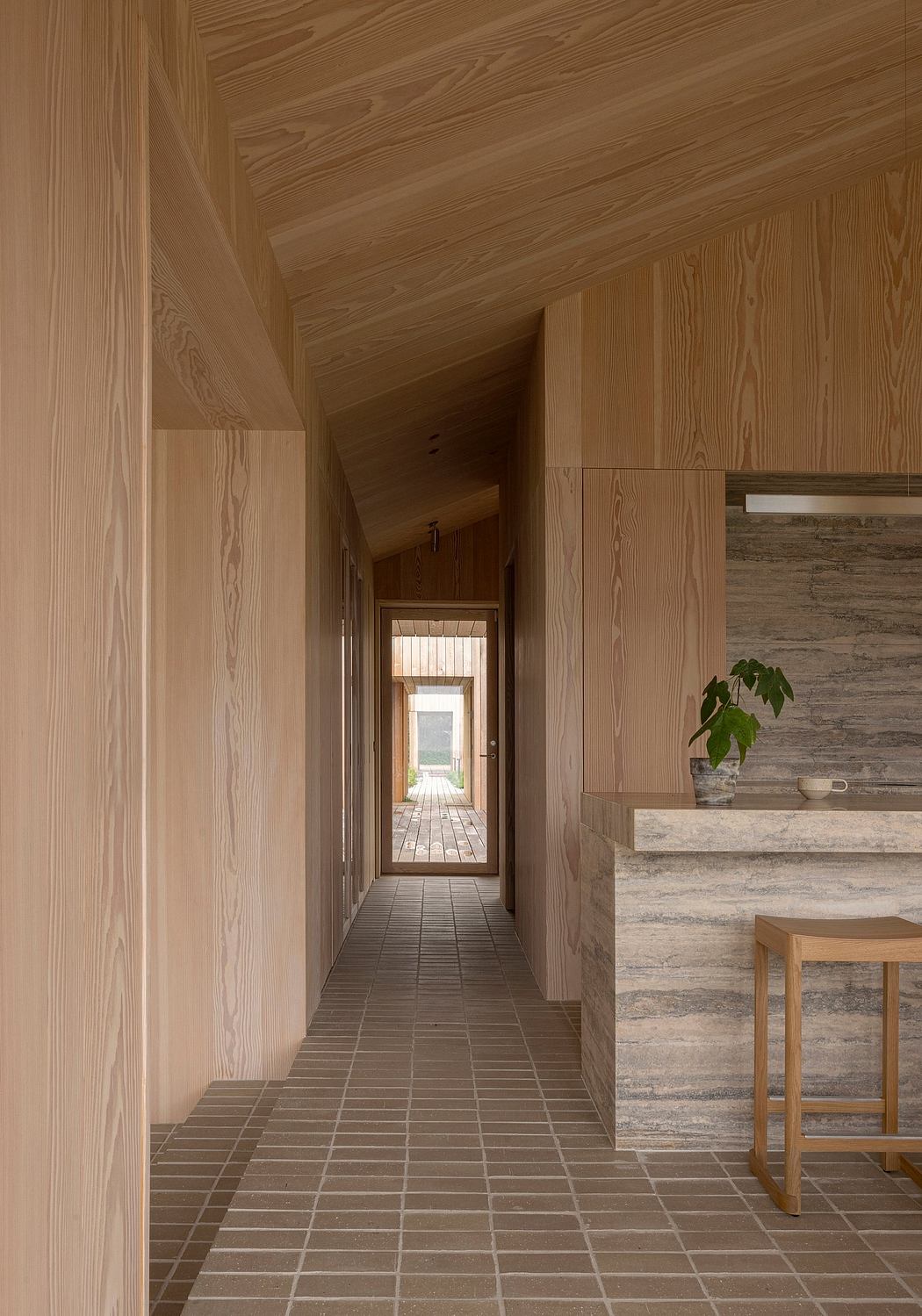 Contemporary wooden hallway with tiled floor and minimalist design.