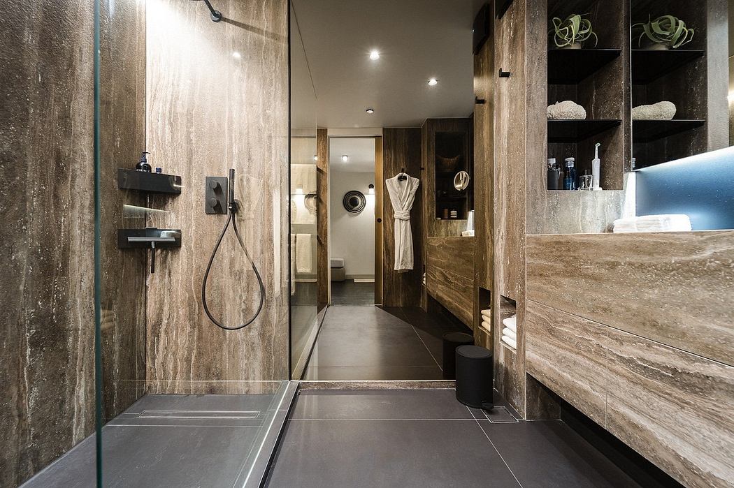 Modern bathroom interior with wood accents and glass shower.