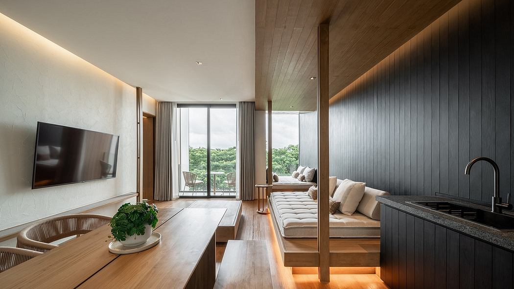 Modern living room with wooden features, large window, and cozy seating area.