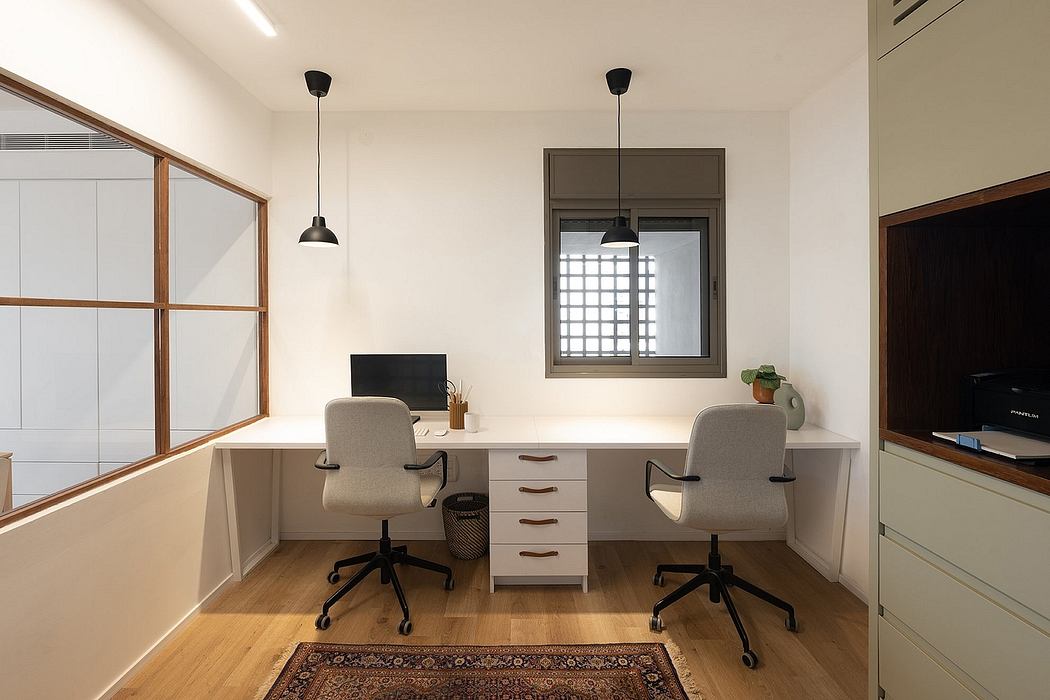 Modern home office with a dual workstation, pendant lights, and wooden accents.