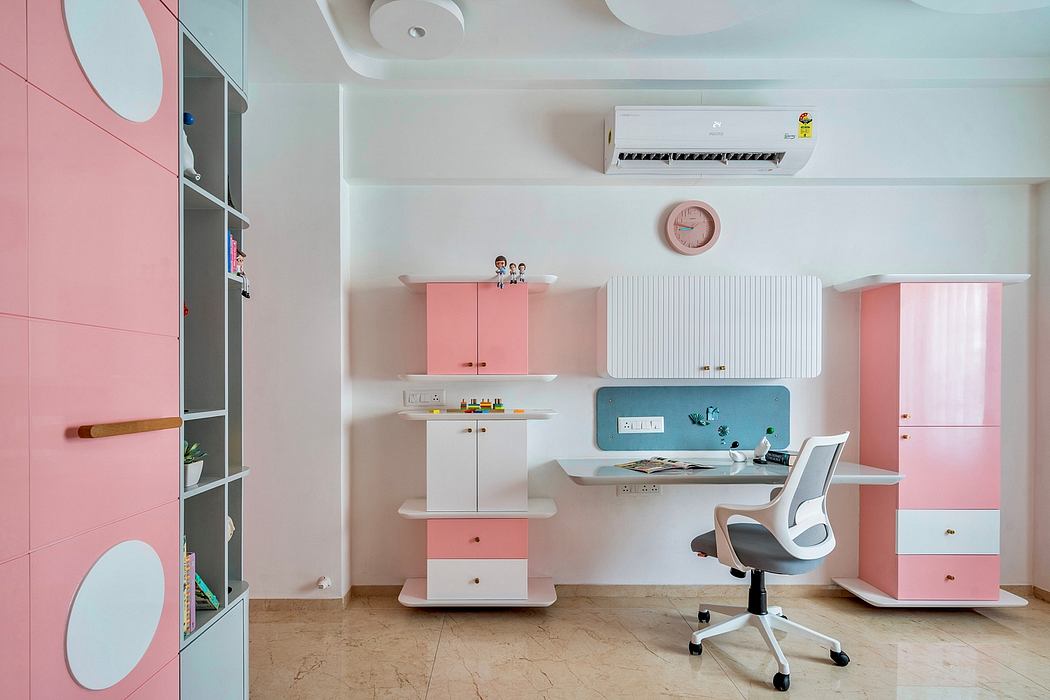 Bright room with pink and white children's study furniture and a swivel chair.