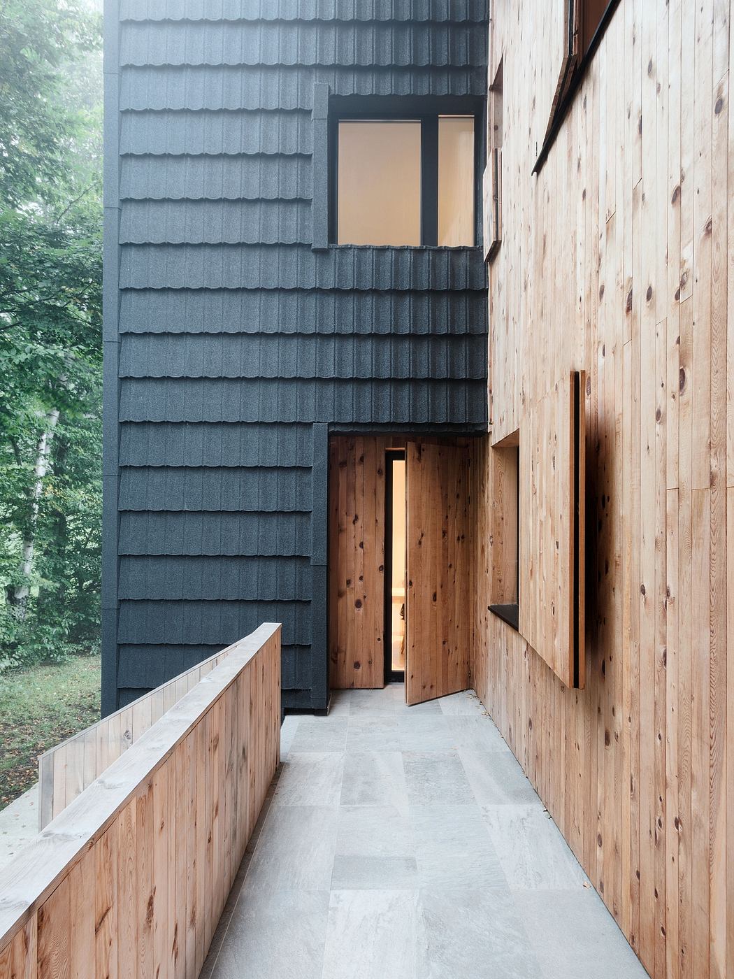 Striking architectural details with contrasting wood and slate siding, creating a modern aesthetic.