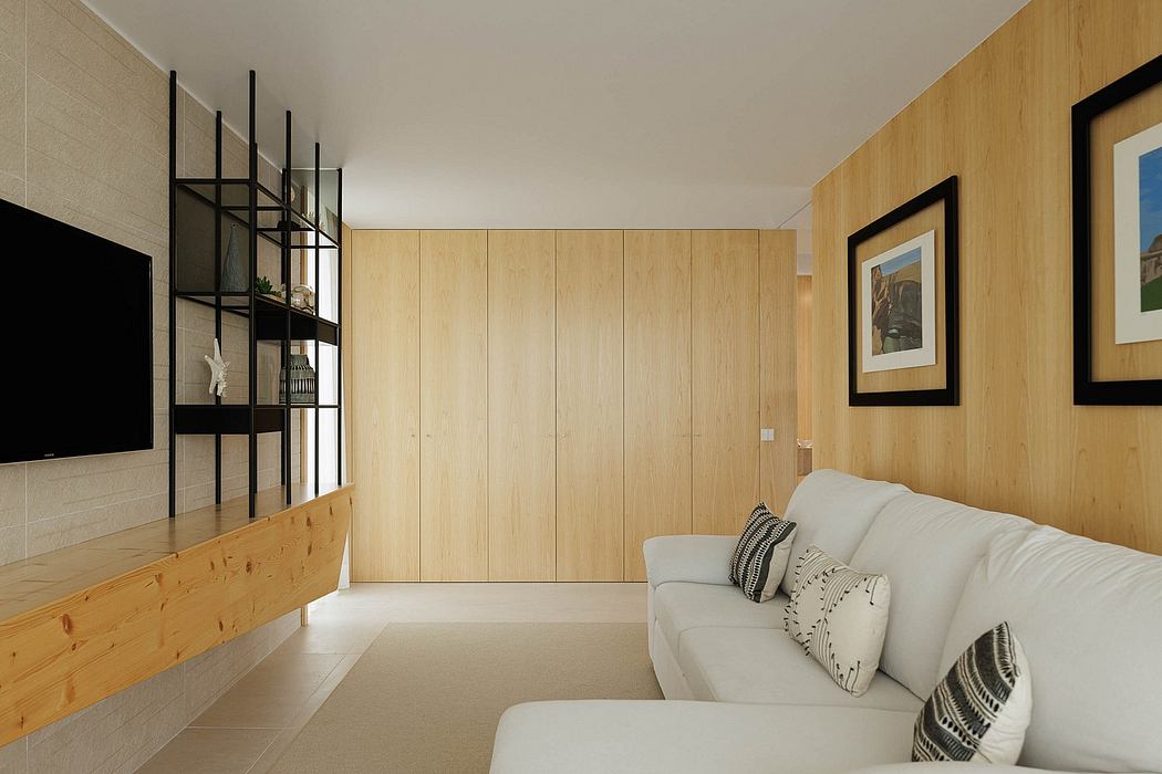 Minimal, modern living room with wood paneling, floating TV stand, and framed artwork.