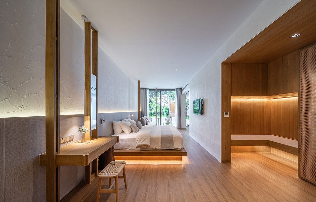 Modern bedroom with wood accents, large bed, and floor-to-ceiling windows.