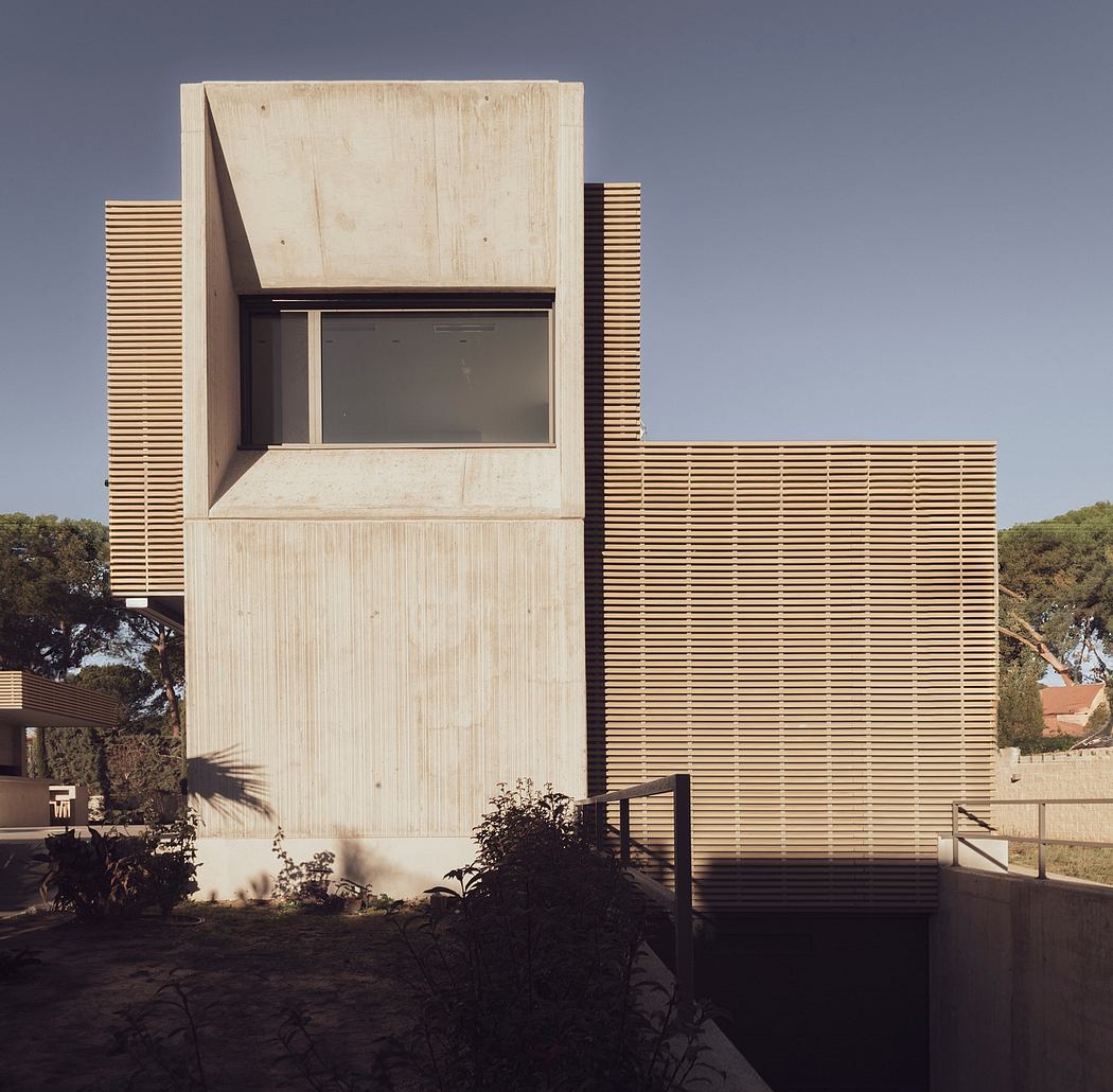 Contemporary concrete house with horizontal slat details.