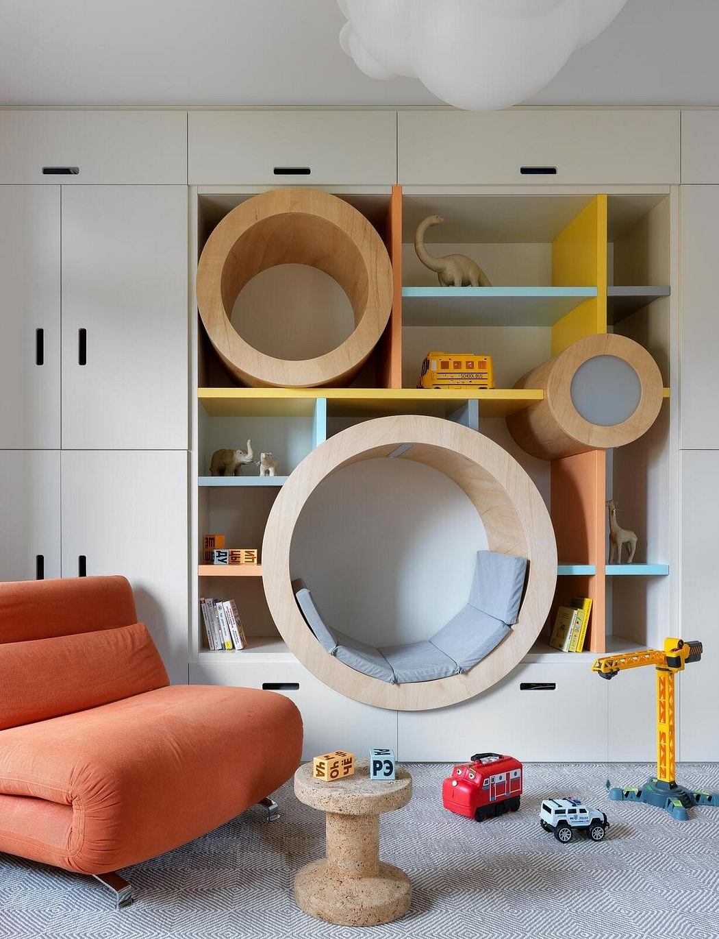 Vibrant, playful children's room with modern storage and cozy seating.