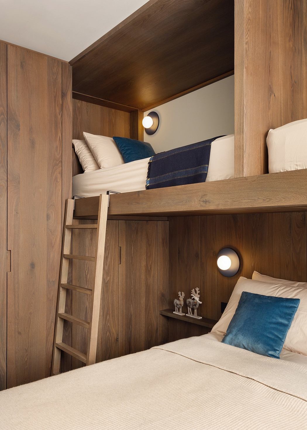 Wooden bunk bed setup with ladder and built-in lighting.